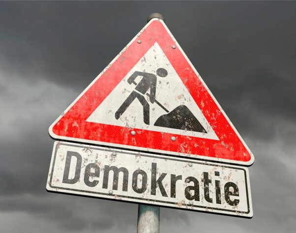 3d,Illustration,Road,Sign,With,The,German,Word,“demokratie“,(democracy)