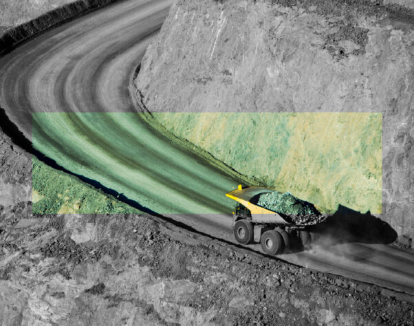 a mining vehicle on the road. black and white image, with a central envelop of green and yellow