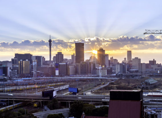 Sun rays over city skyline - Johannesburg